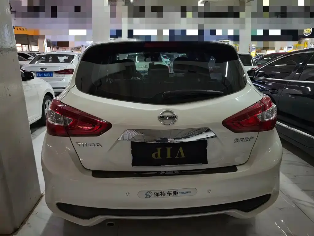Nissan Tiida — фото 10