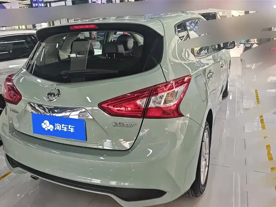 Nissan Tiida — фото 10