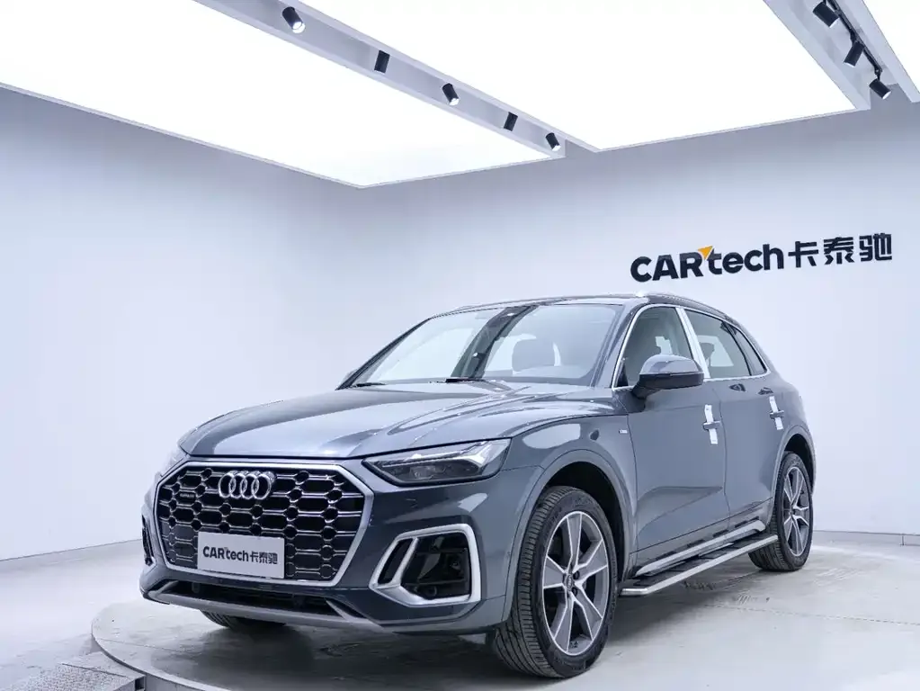 Audi Q5L — фото 10