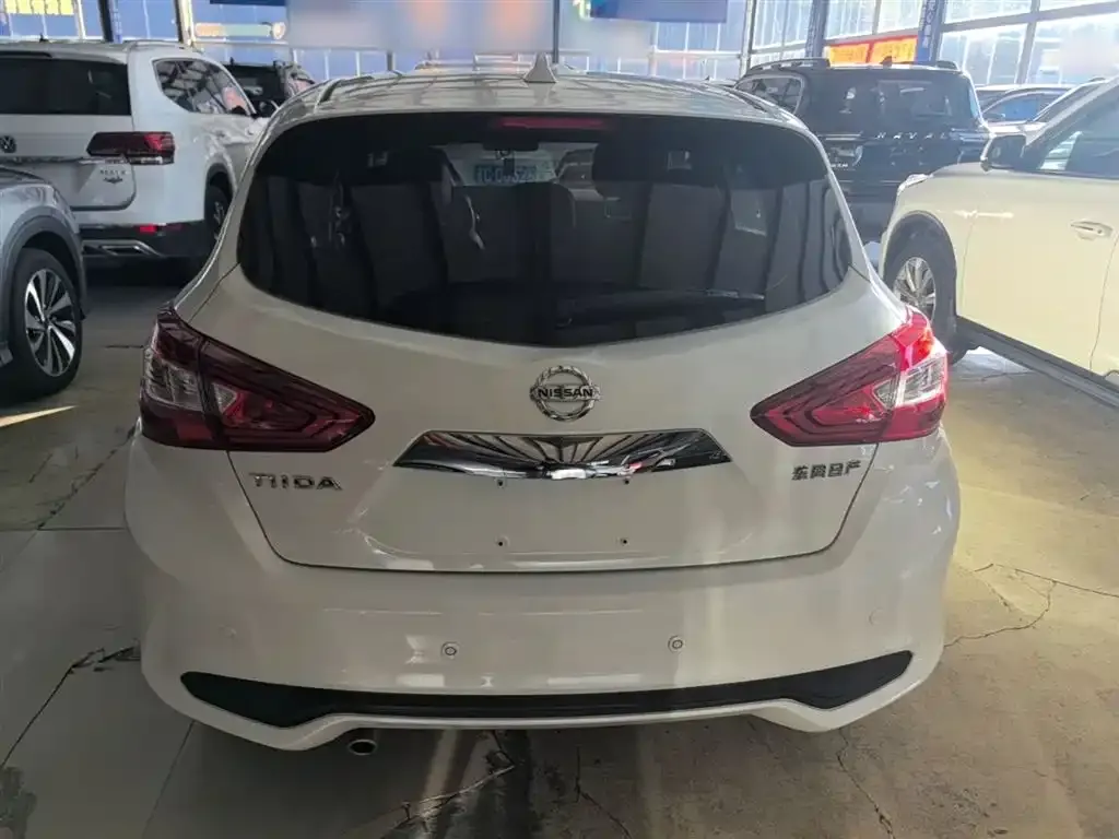 Nissan Tiida — фото 10