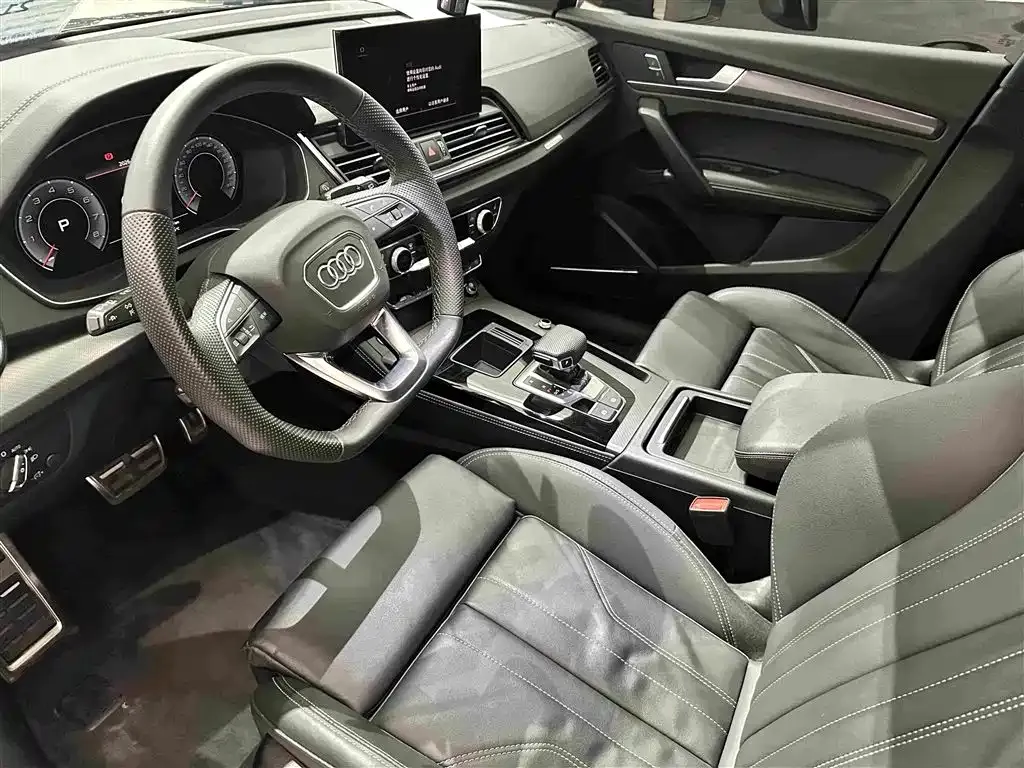 Audi Q5L — фото 10