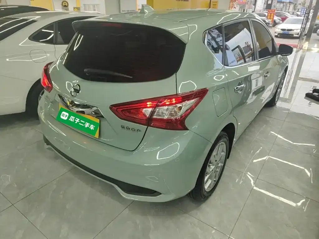 Nissan Tiida — фото 10