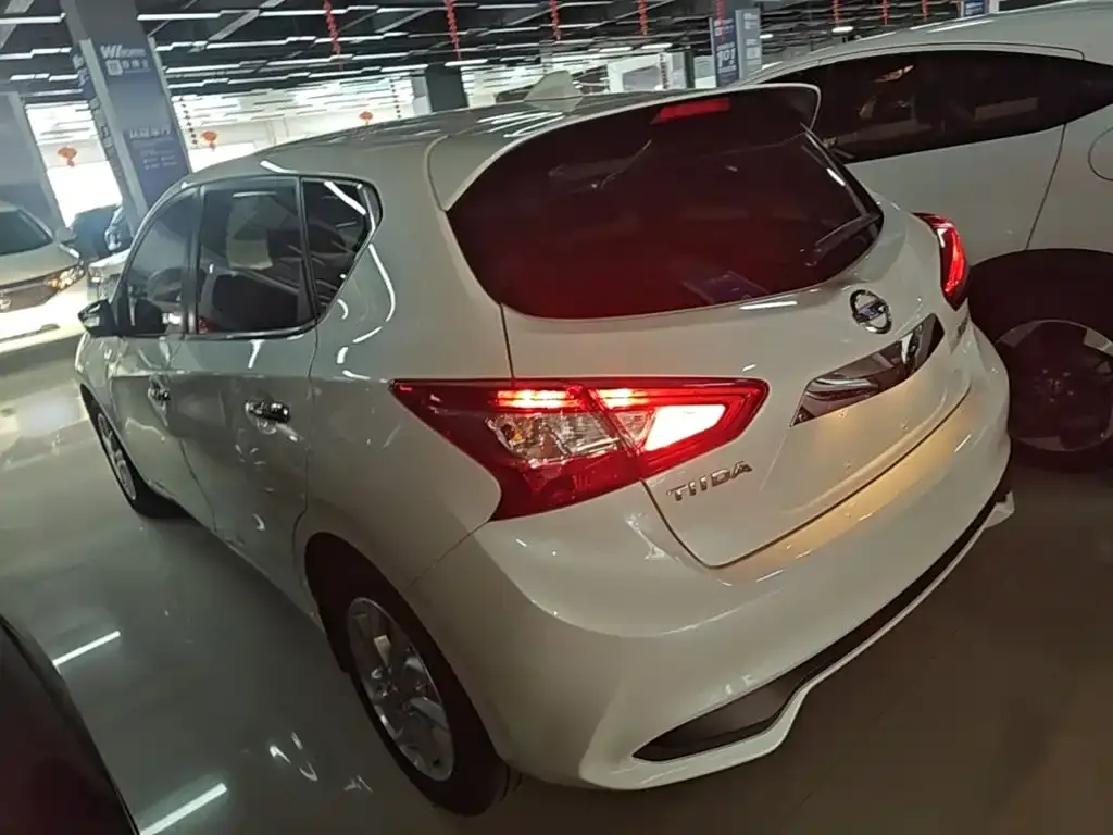 Nissan Tiida — фото 8