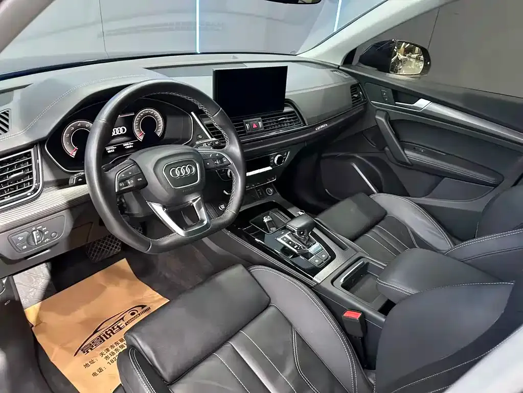 Audi Q5L — фото 10