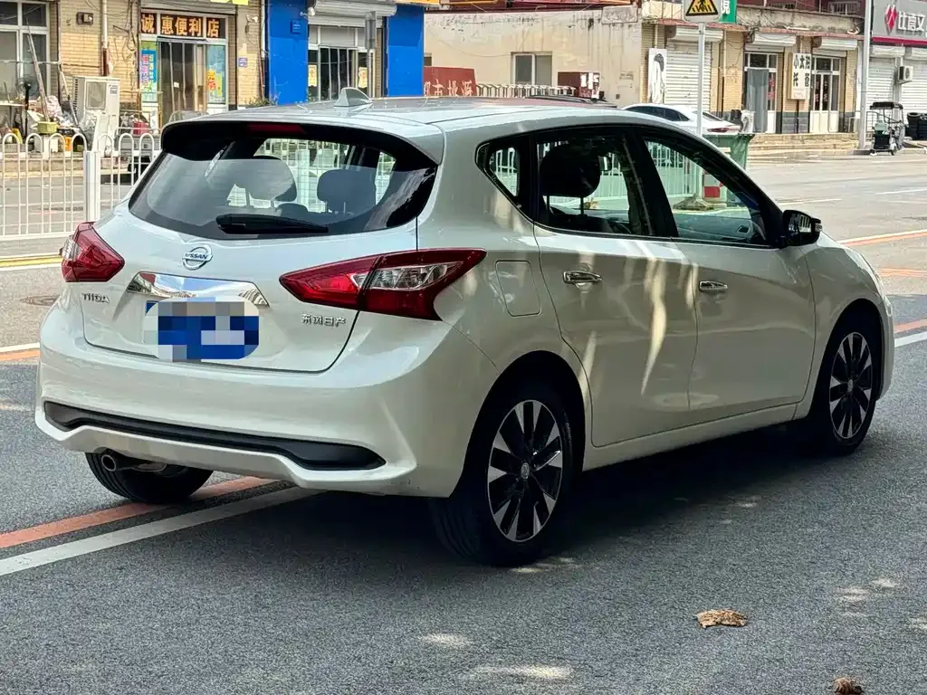 Nissan Tiida — фото 9
