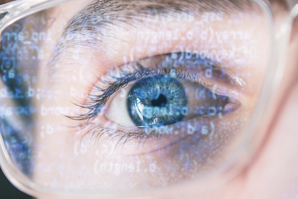 closeup-shot-hacker-s-blue-eye-wearing-optical-glasses-with-data-code-reflecting-glass_181624-60953-optimized.jpg