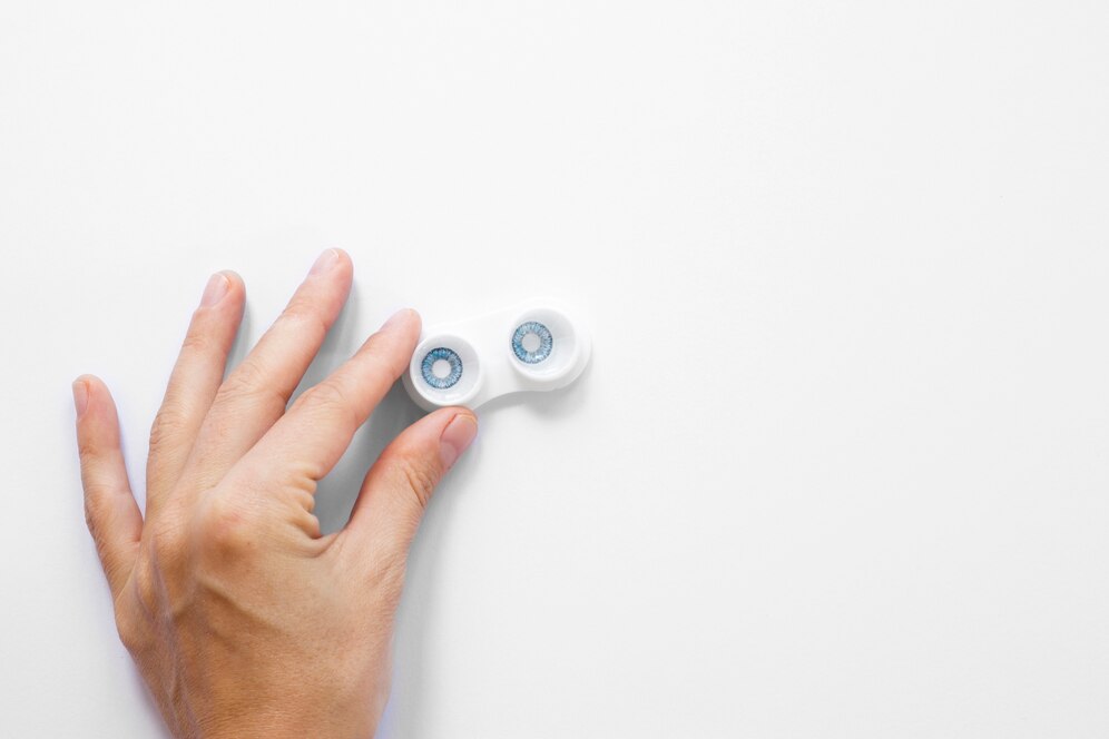 top-view-person-holding-eye-contacts-with-copy-space_23-2148320329.jpg