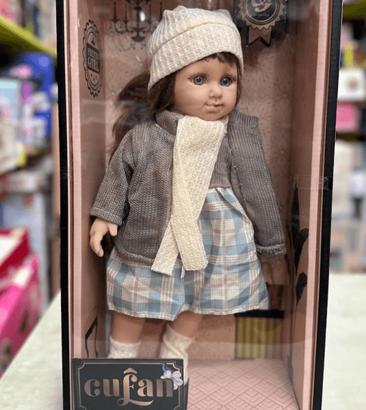 Кукла в теплом платье