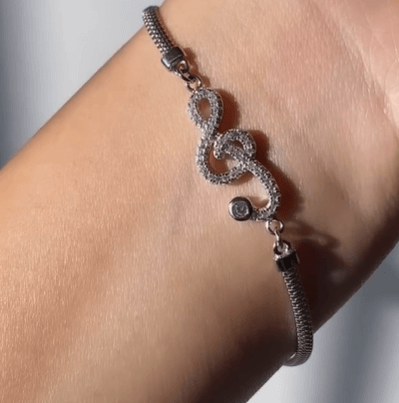 Браслет со скрипичным ключом / Серебро 925 пробы, цирконы