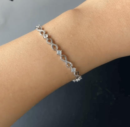 Браслет с бесконечностями / Серебро 925, цирконы