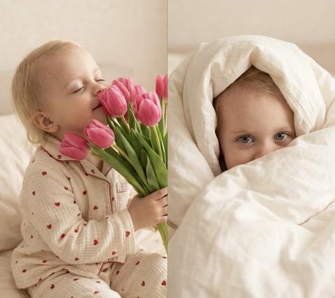 Создай, не изменяя черты лица. Эстетичный фотоколлаж из четырех кадров. Маленькая девочка  играет в светлой постели. На ней пижама брюки и рубашка из муслина кремового цвета с принтом в виде маленьких красных сердечек. Постельное белье в тон пижаме, также с красными сердечками.
Детали кадров: > 1. Крупный план босых детских пяток на фоне простыни. 2. Девочка лежит на спине, радостно улыбается и держит в руках букет ярко-розовых тюльпанов. 3. Девочка зажмурилась от удовольствия, вдыхая аромат цветов. 4. Портрет девочки, выглядывающей из-под пышного белого одеяла.
Стиль: Мягкое теплое освещение, высокое разрешение, стиль профессиональной домашней фотосессии, пастельные тона, атмосфера нежности и весеннего праздника.