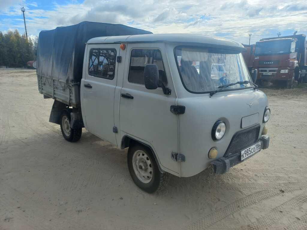 390945