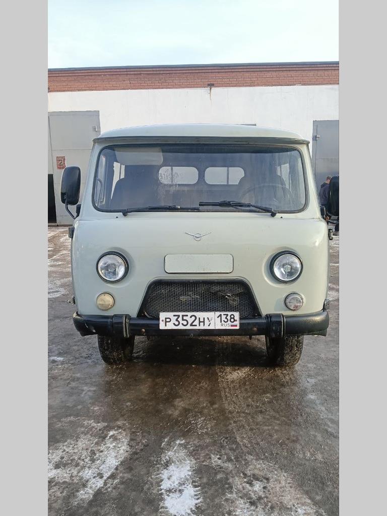 390945