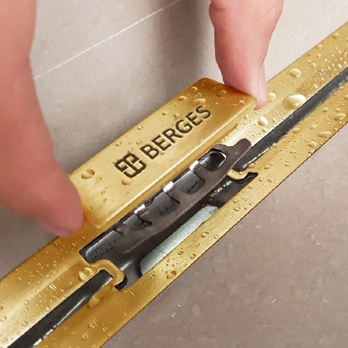 Душевой лоток BERGES SIMPEL 1000, золото глянец, S-сифон D50 H60 боковой 092113 Душевой лоток BERGES SIMPEL 1000, золото глянец, S-сифон D50 H60 боковой 092113