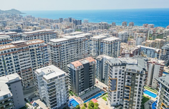 Светлая квартира 1+1 в современном доме в районе Махмутлар в Турции - фото 5