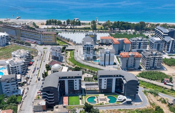 Квартира 2+1 в новом комплексе в 100 м от моря, Каргыджак в Турции - фото 6