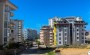 tri-novye-kvartiry-v-800-m-ot-morya-v-raione-dzhikdzhilli-49-118-m2 в Турции - фото 2