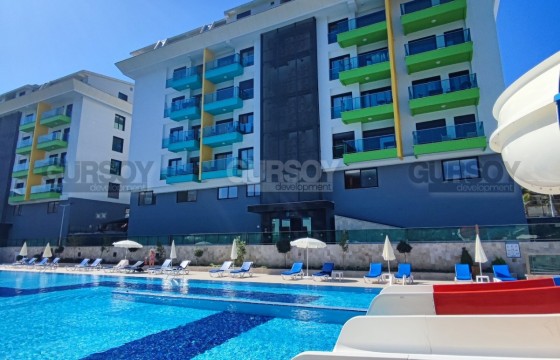 Апартаменты 1+1 в элитном комплексе в районе Каргыджак, 50м2 в Турции - фото 4