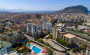 kvartiry-raznyx-planirovok-58-233-m2-na-stadii-stroitelstva-v-centre-alanii в Турции - фото 2