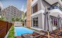 investicionnyi-proekt-s-kvartirami-ot-46-do-117-m2-i-villami-tomyuk-mersin в Турции - фото 2