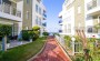 dvukhurovnevye-apartamenty-s-vidom-na-more-v-konakly-110-kv-m в Турции - фото 2