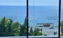 kvartira-planirovkoi-2-1-obshei-ploshadyu-125m2-s-pryamym-vidom-na-sredizemnoe-more-v-raione-makhmutlar в Турции - фото 2
