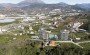 kvartira-1-1-v-elitnom-stroyashemsya-komplekse-v-demirtashe-55-m2 в Турции - фото 2