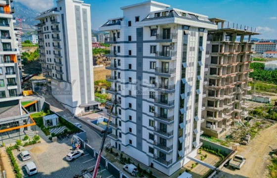 Новая квартира 1+1, на площади 58 м1+2, на 5-м этаже, в центре современного района Аланьи - Махмутлар в Турции - фото 1