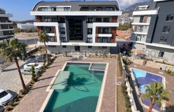 Небольшая новая квартира 1+1, общей площадью 55 м2, на 3-м этаже, в престижном районе Аланьи - Оба в Турции - фото 1