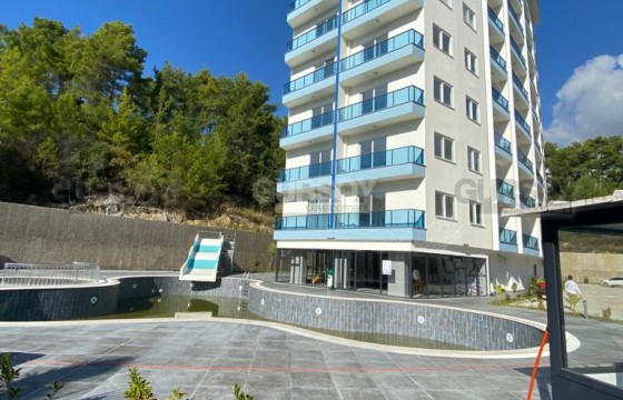 Бюджетная квартира в новом комплексе в районе Авсаллар в Турции - фото 6