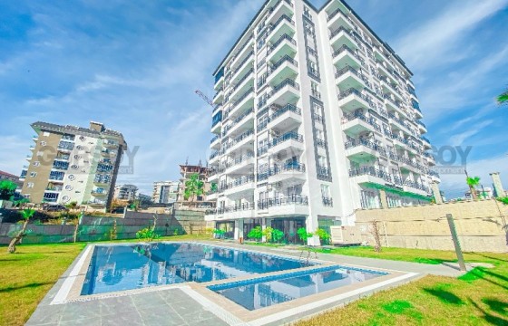 Современная квартира 1+1 в новом комплексе в районе Авсаллар в Турции - фото 1