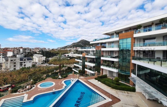 Квартира в живописном районе в современном комплексе с инфраструктурой в Турции - фото 6