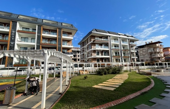 Квартира 1+1 в современном комплексе в районе Клеопатры в Турции - фото 4