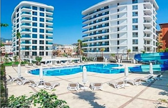 Просторная квартира 1+1 в престижном комплексе у пляжа Клеопатра в Турции - фото 4