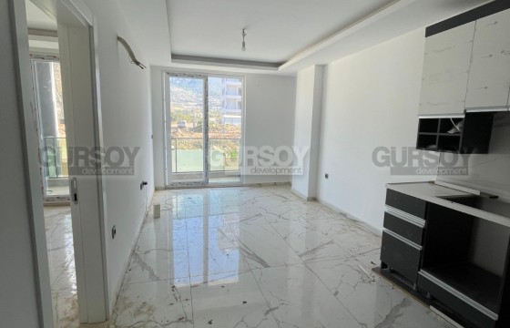 Квартира 1+1 в новом комплексе в Махмутларе — 55 м², 500 м до моря в Турции - фото 7