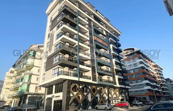 Просторная квартира 1+1 в новом доме в центре Махмутлара в Турции - фото 4