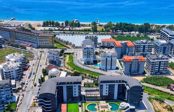 Панорамная квартира 1+1 в красивом комплексе в 100 м до моря в Каргыджаке в Турции - фото 1