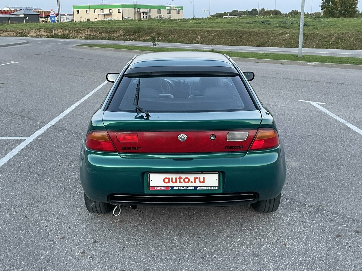 Сзади