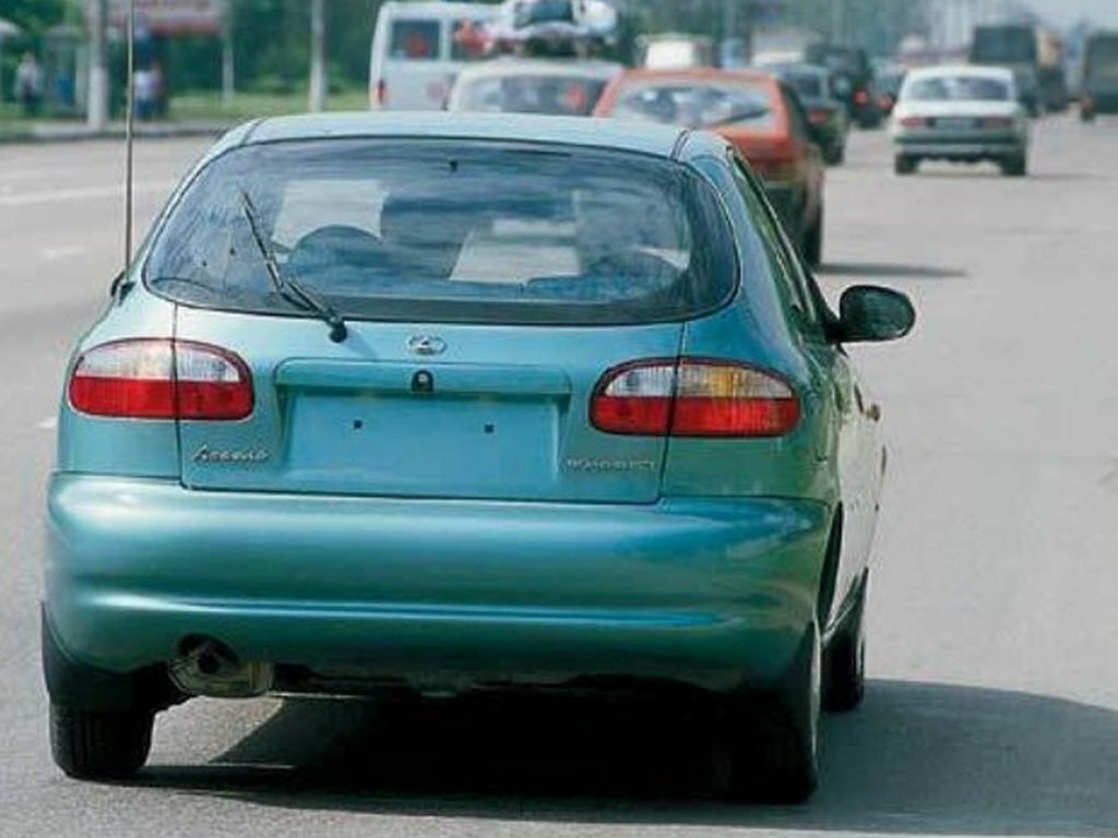Сзади