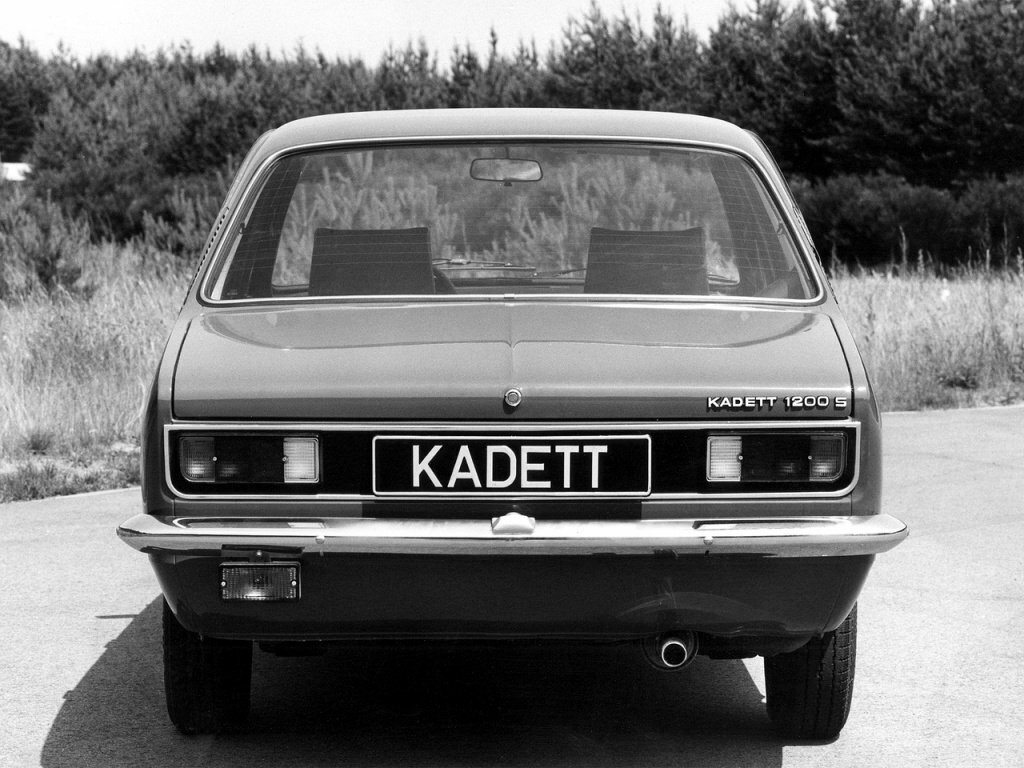 Сзади