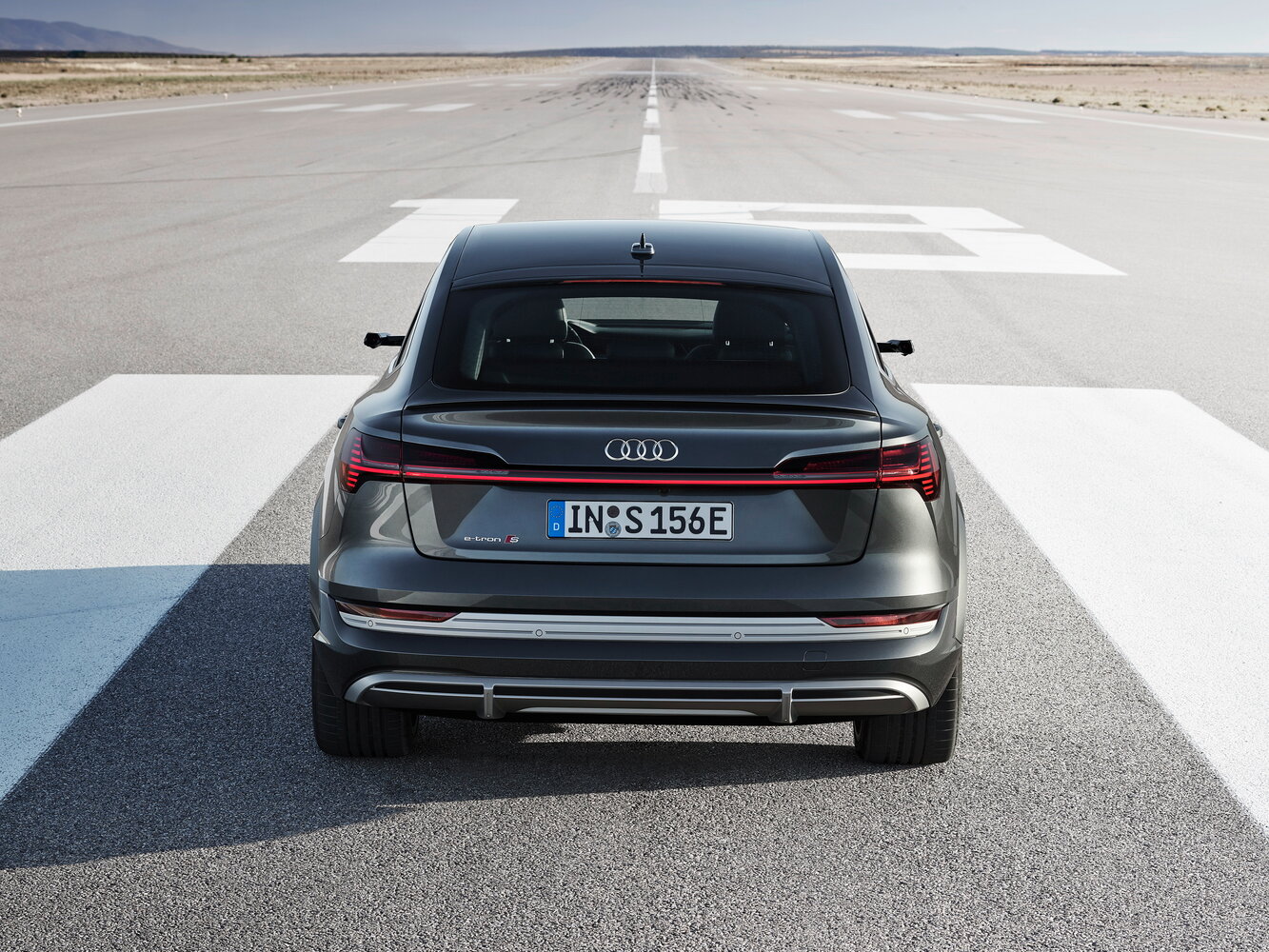 Сзади