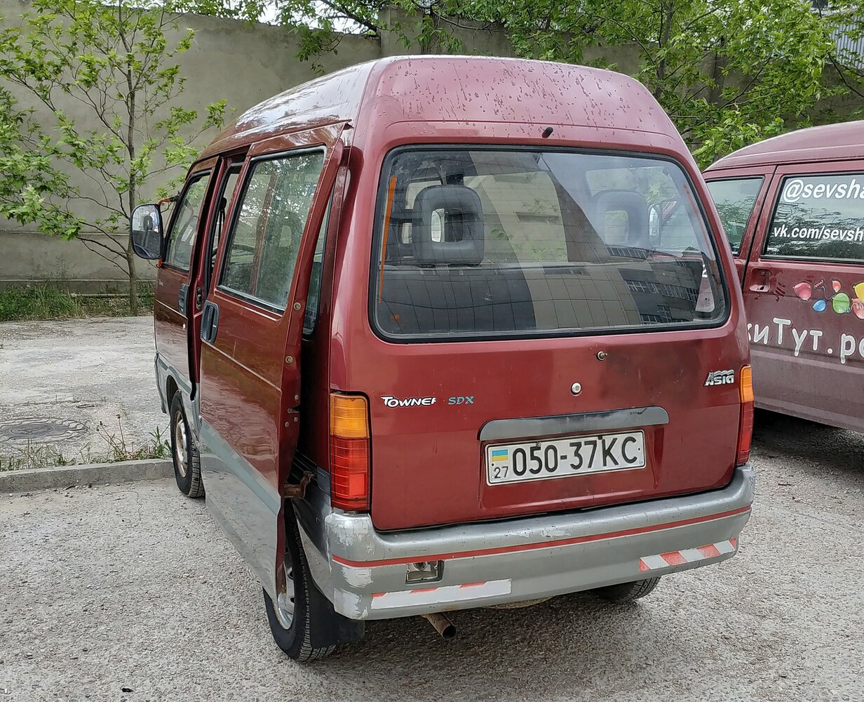 Сзади