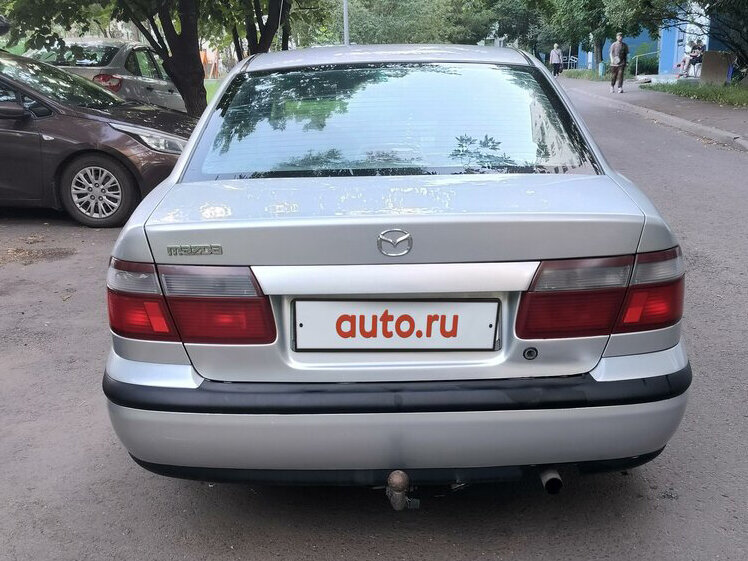 Сзади