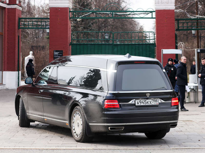 Сзади