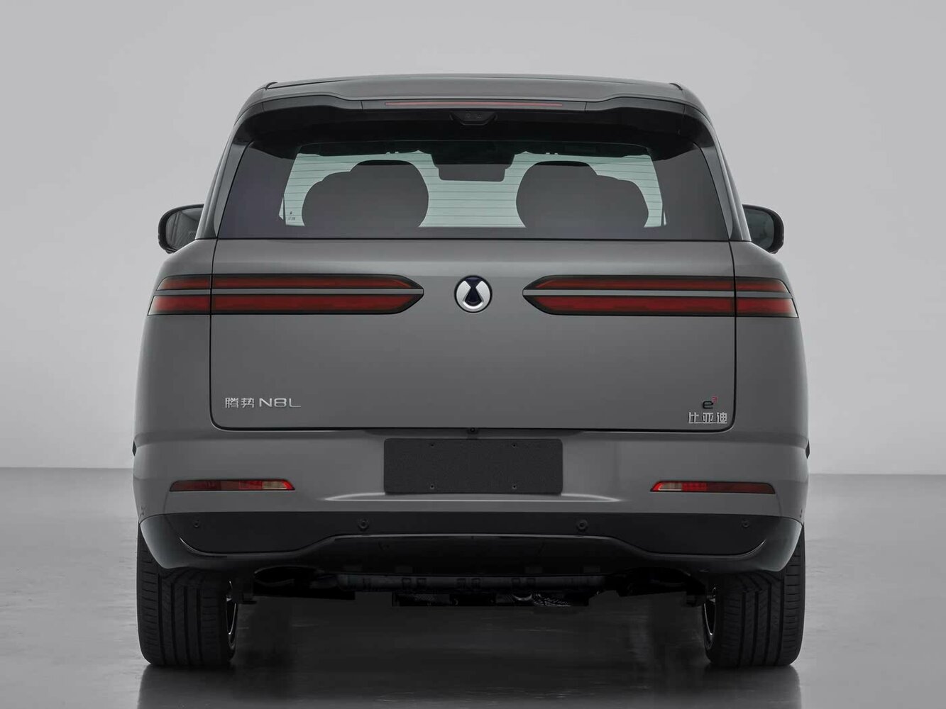Сзади