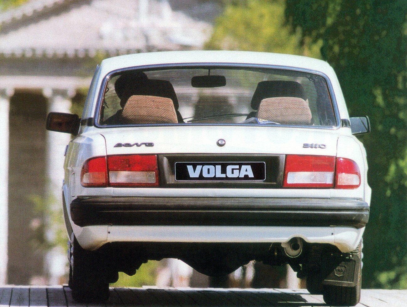 Сзади
