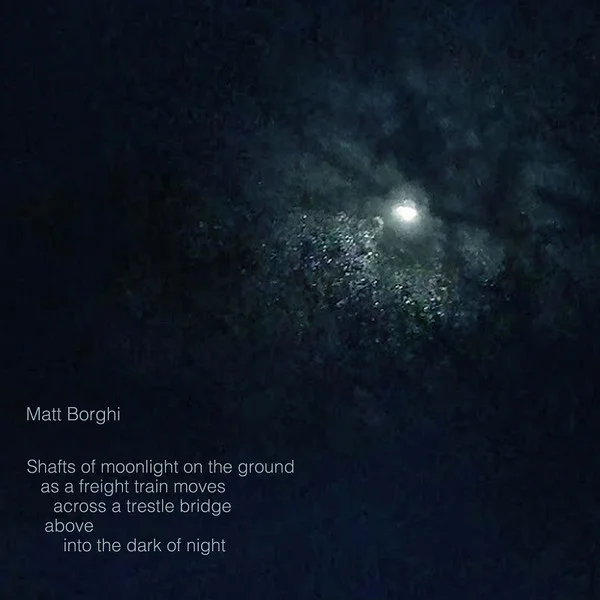 Shafts Of Moonlight On The Ground As A Freight Train Moves Across A Trestle Bridge Above Into The Dark Of Night