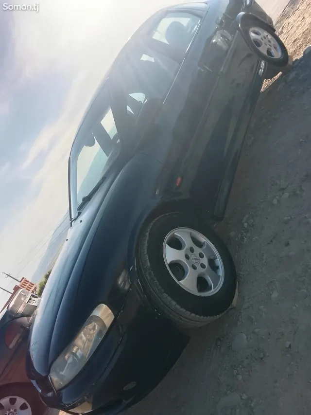 Opel Astra J 1997 · 1.8 AT