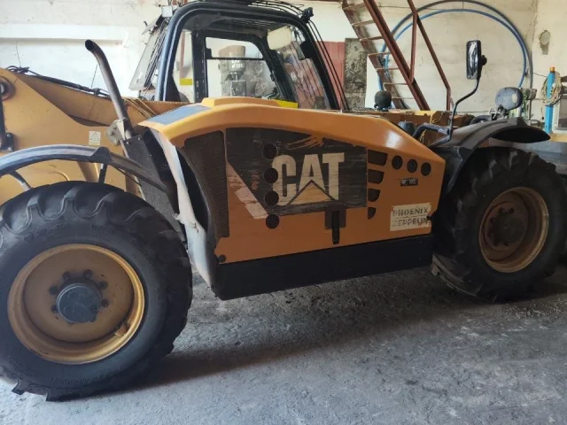 Фото: Телескопический погрузчик caterpillar 407 s 2008 года на полном ходу цена 2,9 млн рублей , Каховка тел
