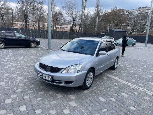 Фото: Продам лансер 2008 г. 1.6. Цена 250т. Мотор дымит и ест масло. По ходовке все ок. По кузову на 4